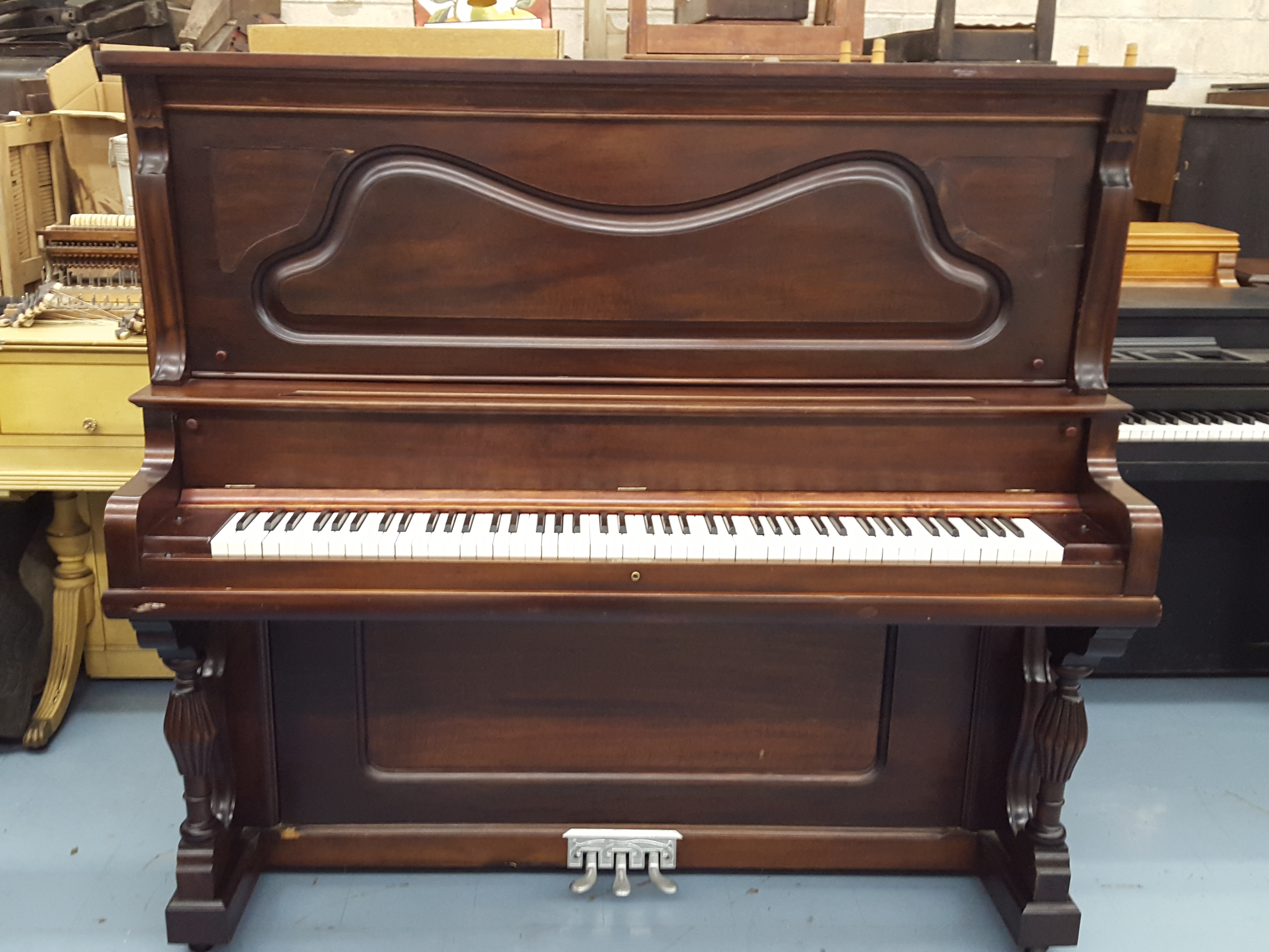 This piano has been restored. We are still working on it. 